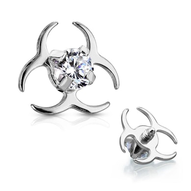 Ancre dermal en forme de symbole biohazard avec des pierres-Brillant