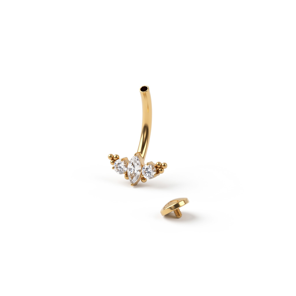 Piercing au nombril flottant en titane et design vintage