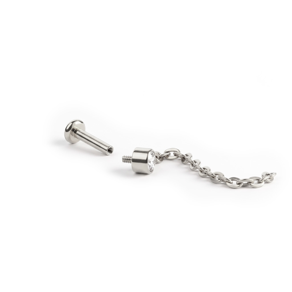 Labret subtil en titane avec une pierre sertie et une chaîne pendante