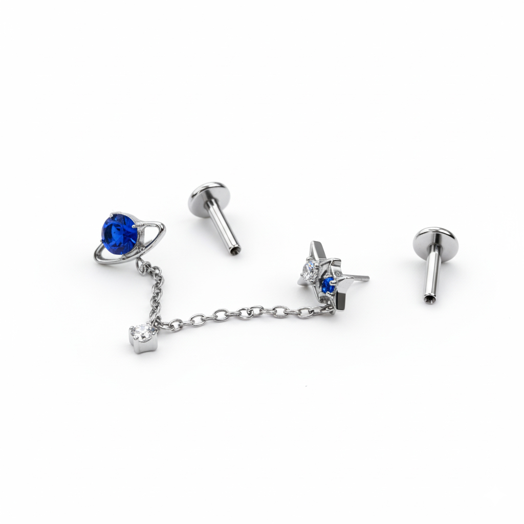 Duo de labrets en titane sur le thème de l'espace