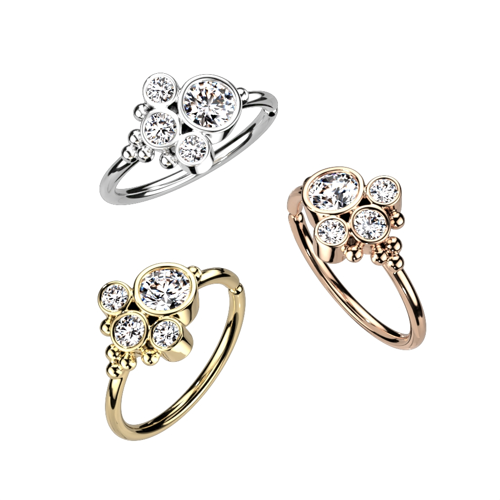 Anneau torsadé orné de pierres rondes dans une monture